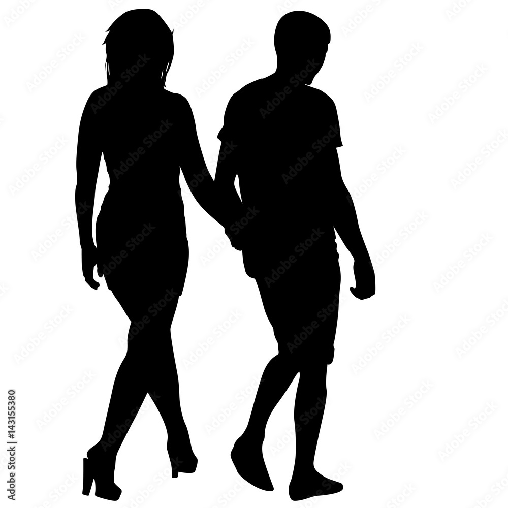 Silhouette man and woman walking hand in hand