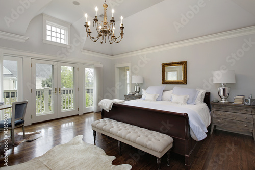 Master bedroom with doors to balcony