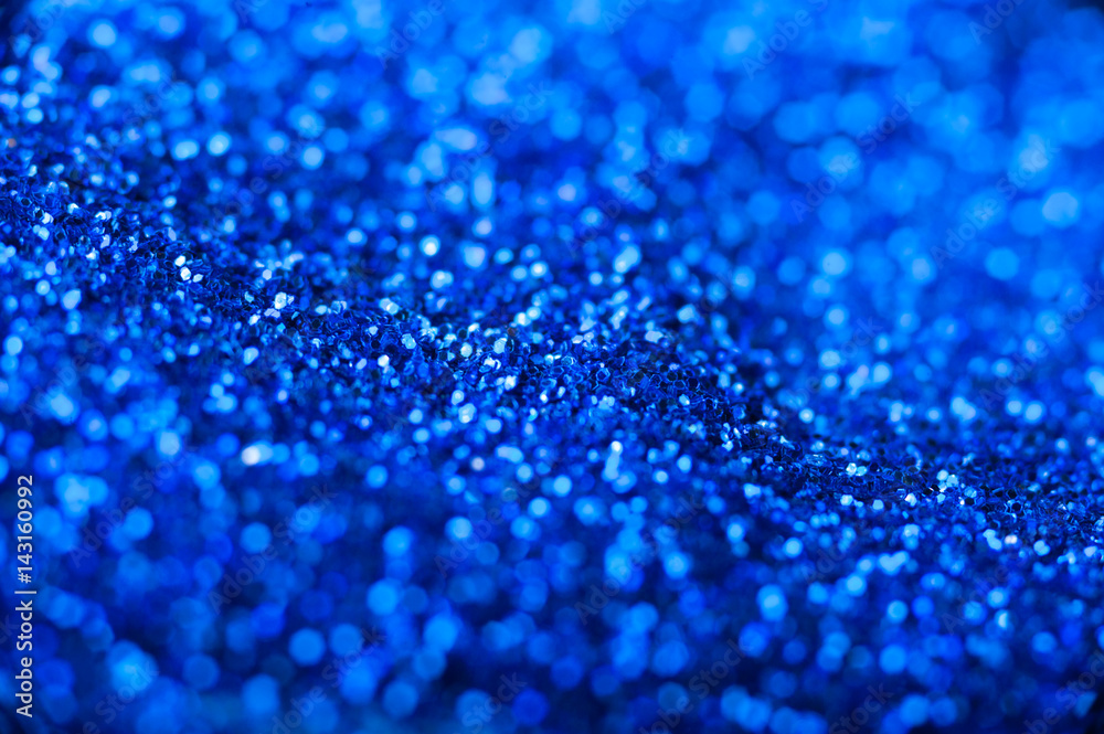 Blue bokeh glitter texture. Shallow depth of field