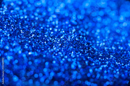 Blue bokeh glitter texture. Shallow depth of field