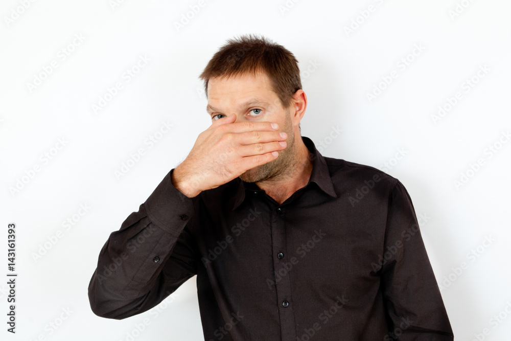 The young man was frightened and hid his face in his hand The young man was frightened and hid his face in his hand