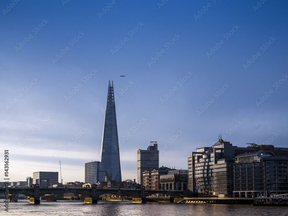 Sunrise over The Shard Building and River Thames, London.