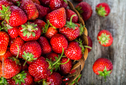 Fresh strawberries in the basket, fruits on farmer market table