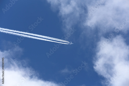 airplane on the cloudy sky