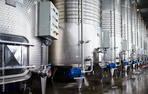 Row of steel cisterns for wine storage 