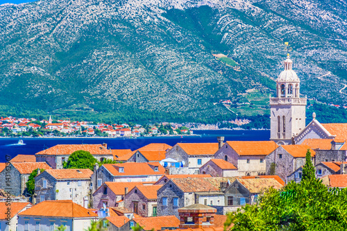 Korcula town. / Aerial view on Korcula town with Orebic place on peninsula Peljesac, Southern Croatia, Europe. photo