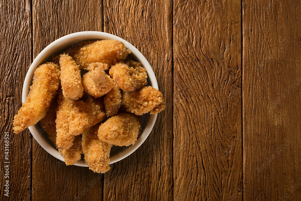 Chicken fried portion on the wood background Chicken fried portion on the wood background