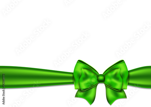 Green silky bow on a white background.