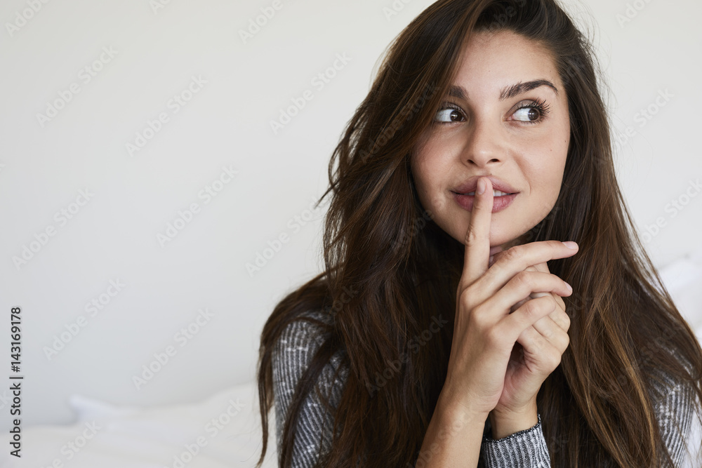 Beautiful brunette with a secret, looking away Beautiful brunette with a secret, looking away