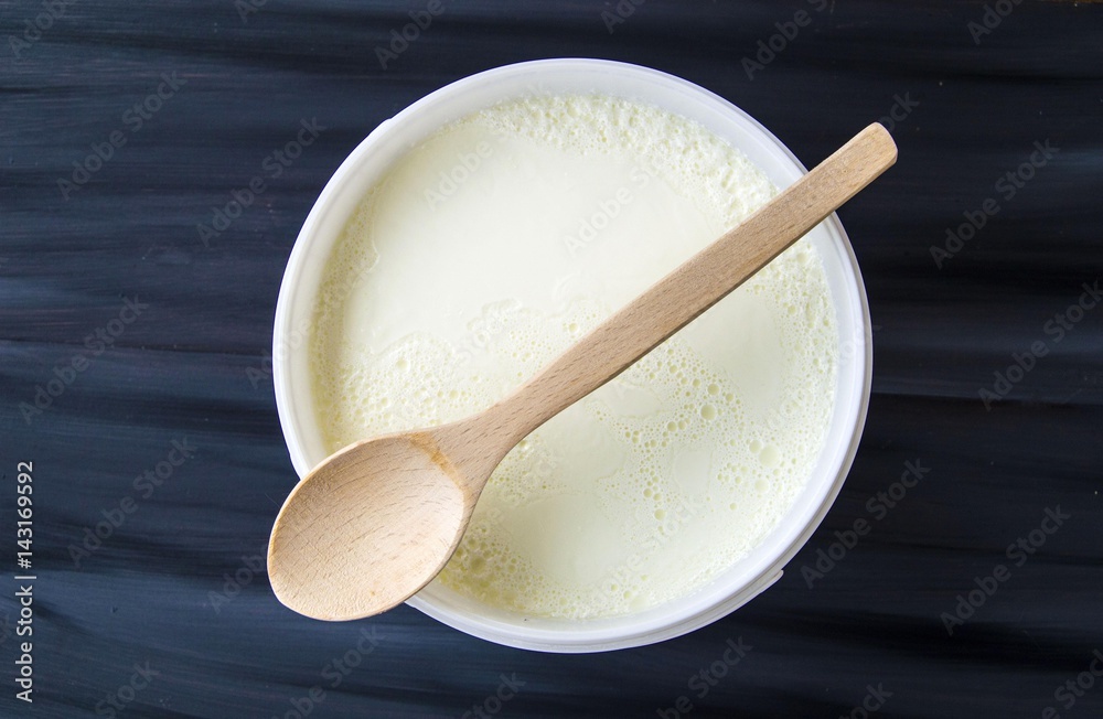 Yogurt in the bucket, yogurt fermented, yoghurt with spoon to take
Yogurt in the bucket, yogurt fermented, yoghurt with spoon to take