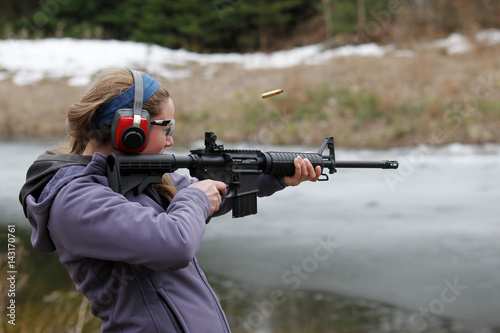 Woman shooting a modern sporting rifle