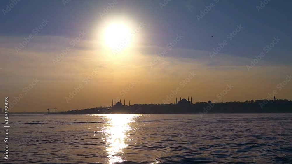 Hagia Sophia and Blue Mosque. Slow motion from the boat on sunset. Blue Mosque and Hagia Sophia just before the sky gets dark again over Sarayburnu, historical peninsula in Istanbul, Turkey Hagia Sophia and Blue Mosque. Slow motion from the boat on sunset. Blue Mosque and Hagia Sophia just before the sky gets dark again over Sarayburnu, historical peninsula in Istanbul, Turkey