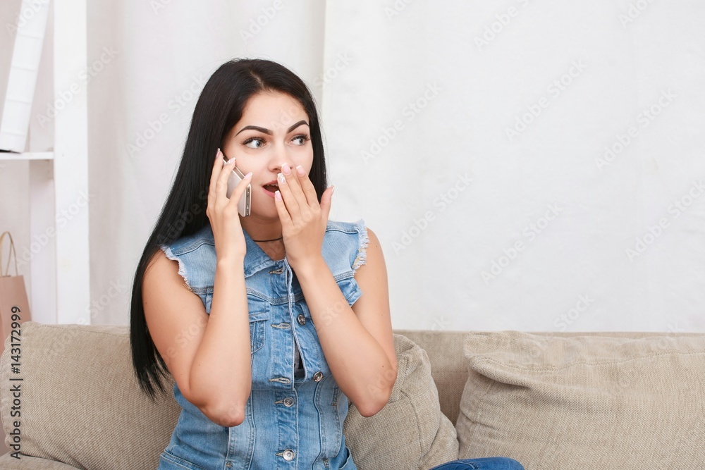 Beautiful young woman speaking by mobile phone indoors Beautiful young woman speaking by mobile phone indoors