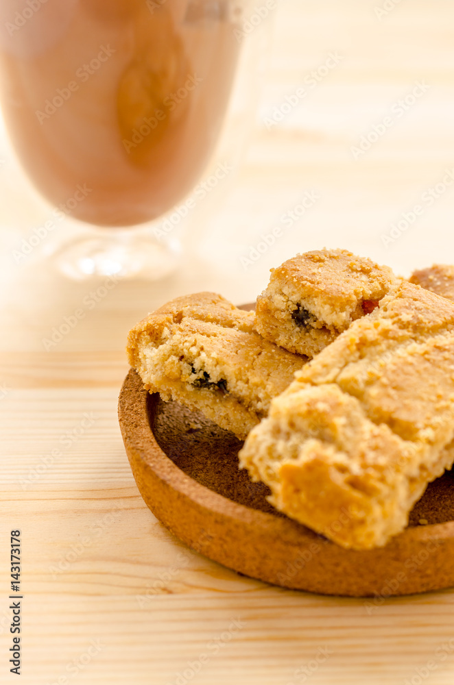 Apple strudel crispy pies and ice coffee on wood background. Apple strudel crispy pies and ice coffee on wood background.