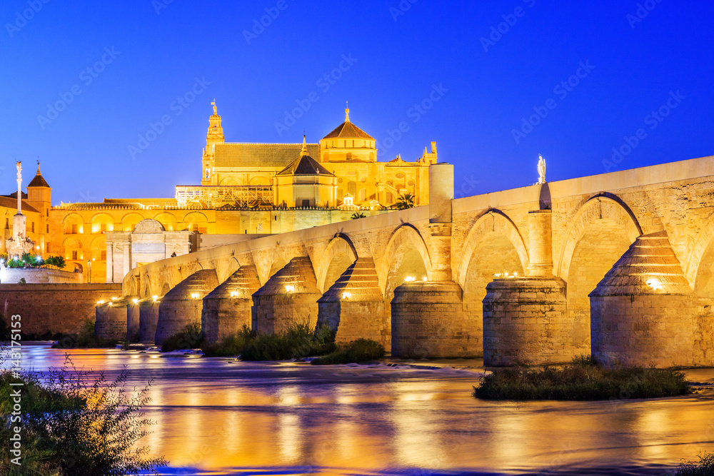 Cordoba, Spain. Roman Bridge on Guadalquivir river and Mezquita Cathedral.