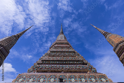 Three pinnacle of pagoda in temple of thaland on blue sky and clound background