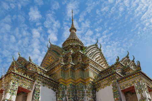 ordination hall in temple of Thailand blue sky and clound background © Pissanu