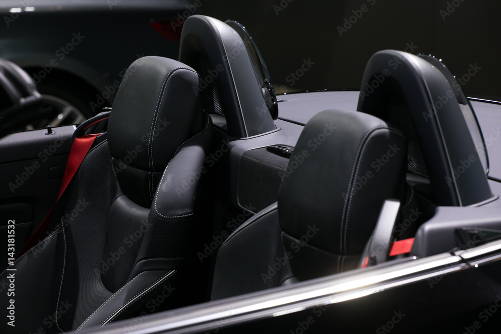 Black leather passenger seat in modern sport car, side  view