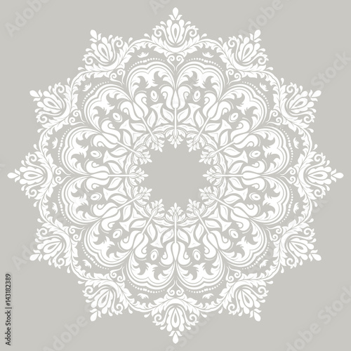 Elegant round white ornament in classic style. Abstract traditional pattern with oriental elements