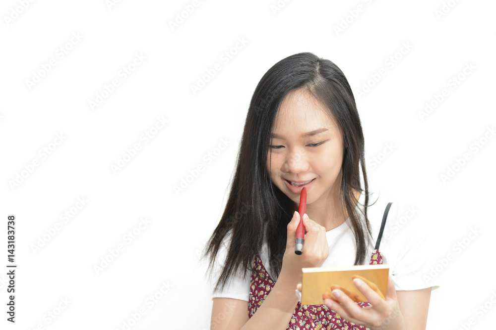Asian woman applying red lipstick with cosmetic pencil on the lips - isolated on white background Asian woman applying red lipstick with cosmetic pencil on the lips - isolated on white background