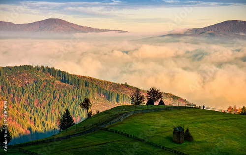mountain rural area in foggy autumn morning