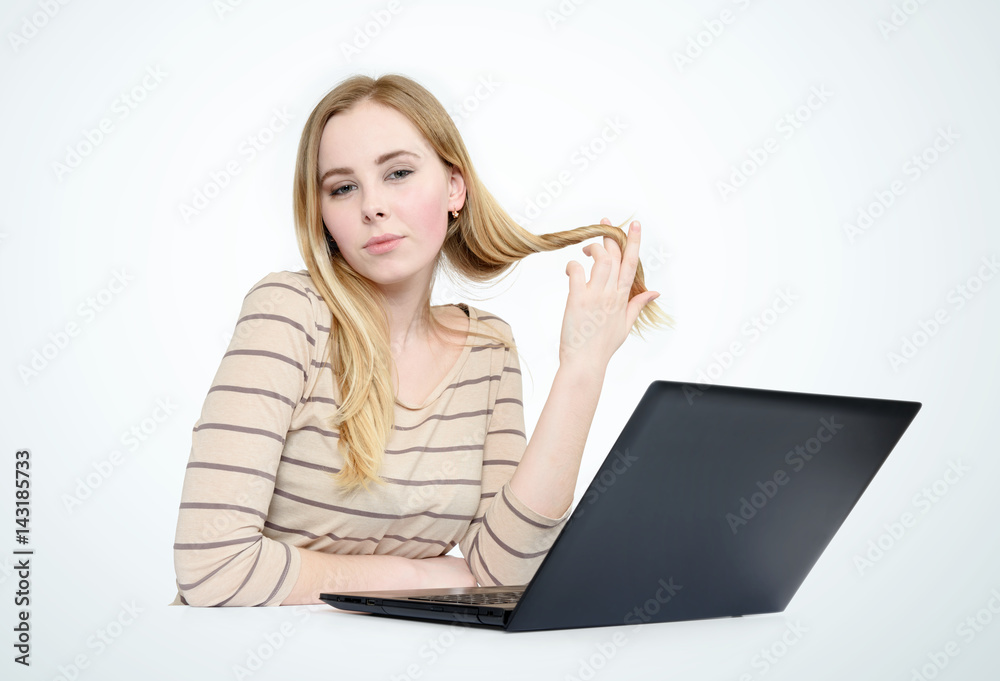 Naklejka premium Beautiful young woman with laptop on light background
