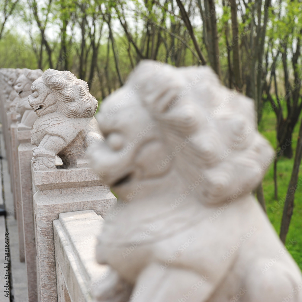 Chinese stone lions in a line.