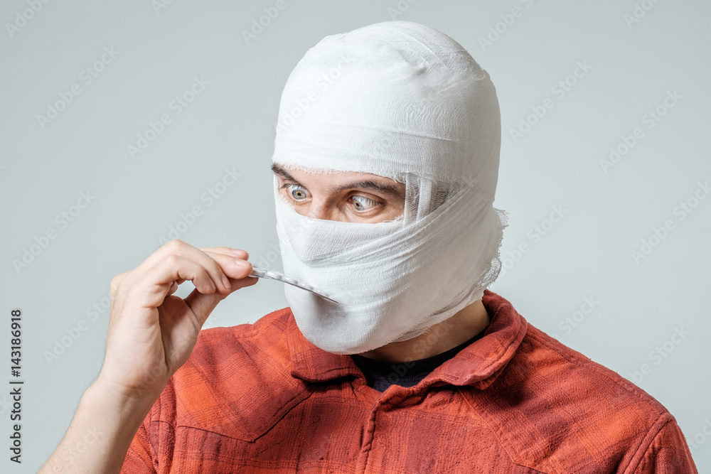Sad injured bandaged man with pills Sad injured bandaged man with pills