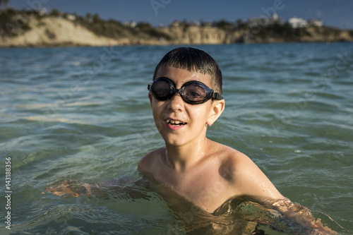 boy with glasses for swimming in the sea © Andrey