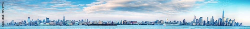 Panoramic sunset view of New York City skyline from Jersey City