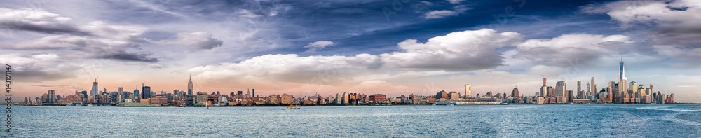 Panoramic view of New York City skyline at dusk