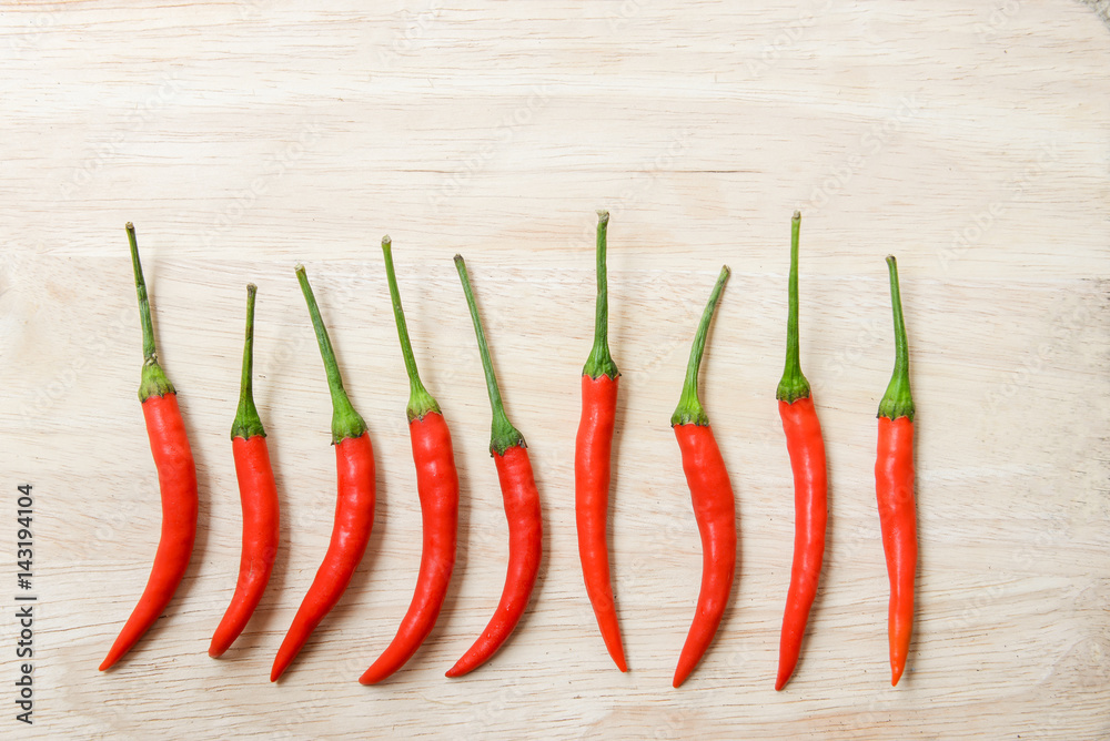 chilli peppers with bright wood background