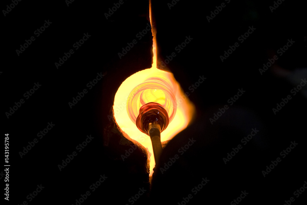 Glass furnace. Glass Blower at Work