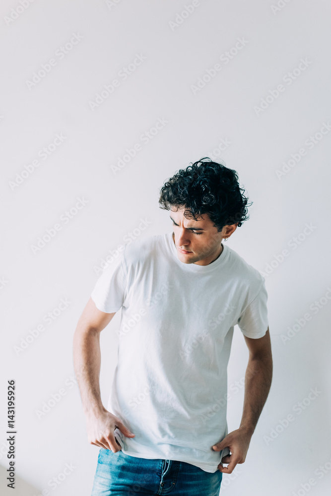 Handsome young man indoor looking away serious - customer, attitude, indipendent concept Handsome young man indoor looking away serious - customer, attitude, indipendent concept