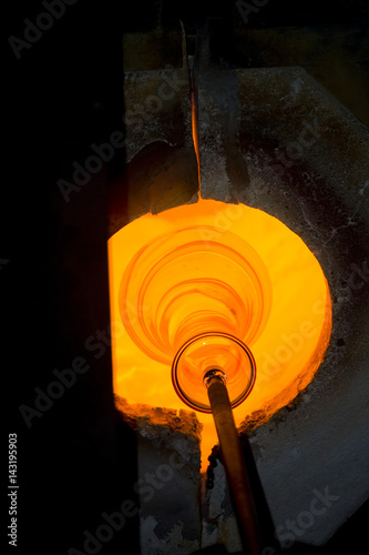Glass furnace. Glass Blower at Work