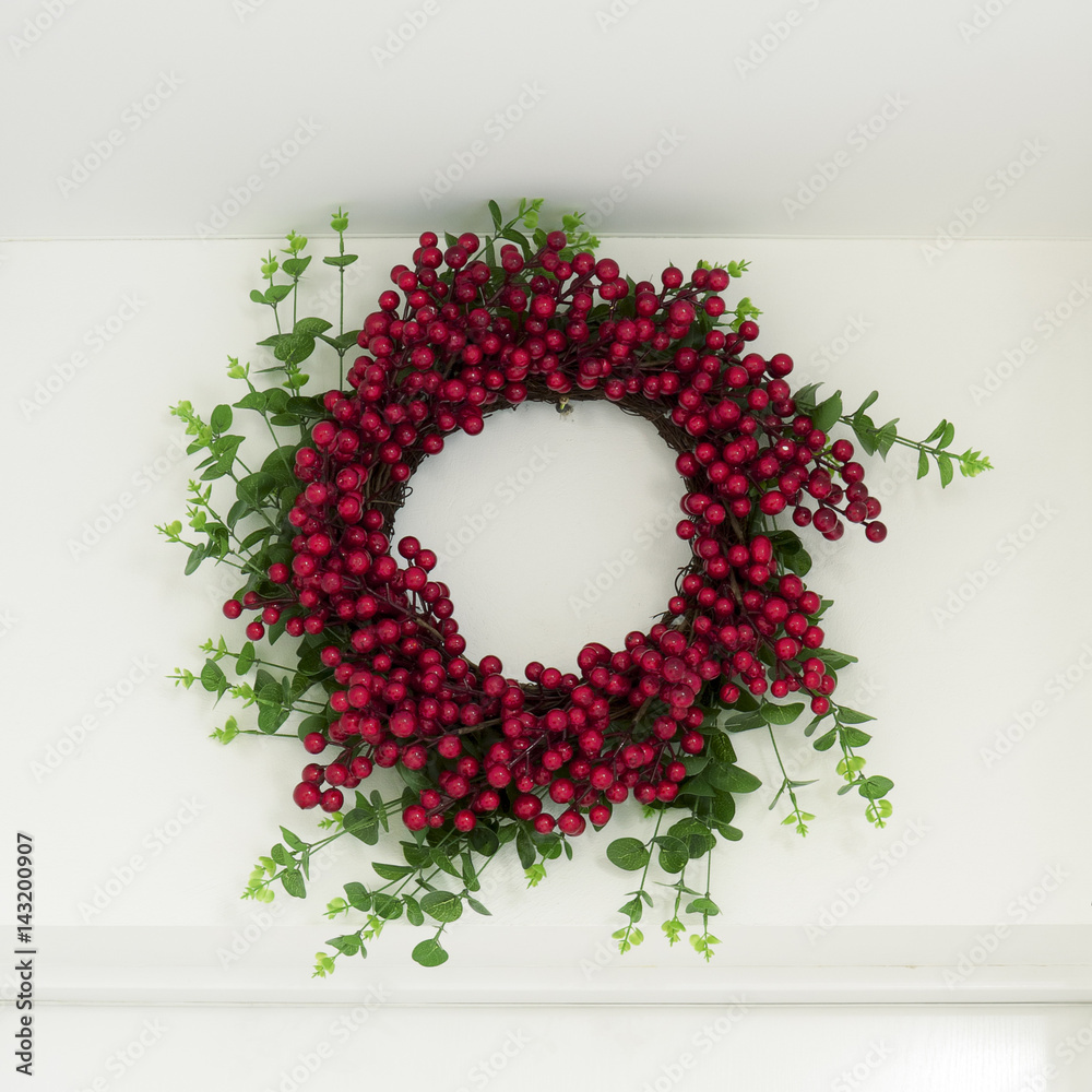 Red wreath above the entrance door