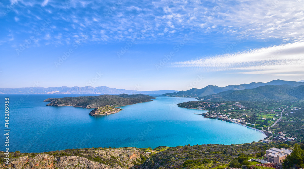Panoramic view of the gulf of Elounda with the island of Spinalonga. Here were isolated lepers, humans with the Hansen's desease and took place the story of Victoria 's Hislop novel 