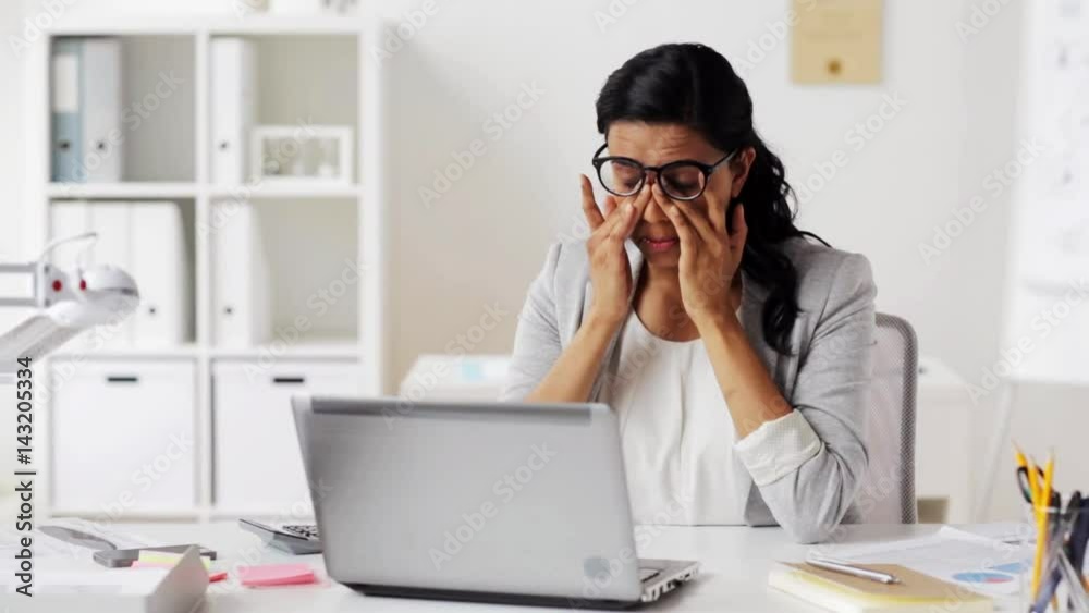 tired businesswoman in glasses at office tired businesswoman in glasses at office