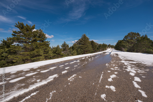 Mountain road covered by snow in winter season  in Neila Lagoons  Burgos  Spain.