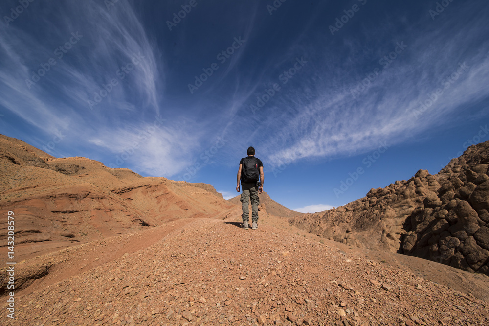 A man walks alone on the mountain in Morocco