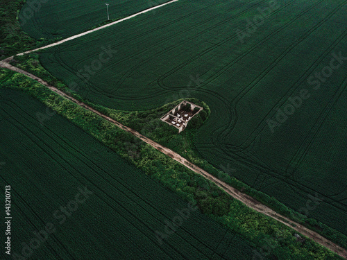 Single house in center of field