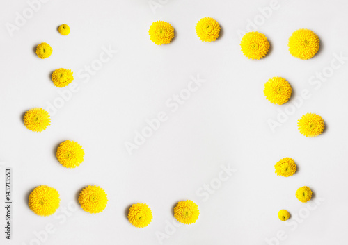 Flowers composition, spring background - Frame made of yellow chrysanthemum flowers on light grey or white background. Easter, spring, summer concept. Flat lay, top view