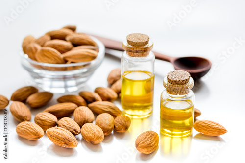 cosmetic and therapeutic almond oil on white background