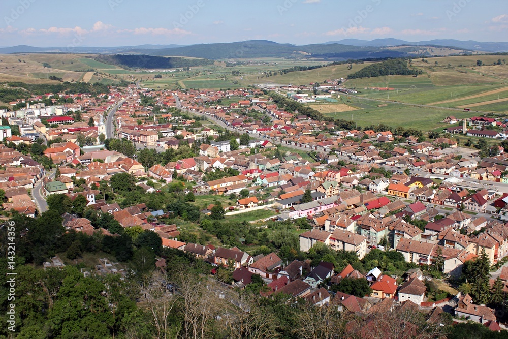Top view of an village with hills in the background