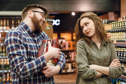 Man wants to by keg of beer but woman against