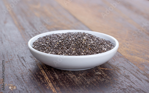 chia seeds / Porcelain dish with chia seeds