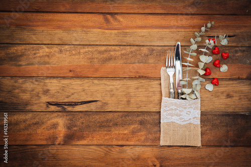  vintage silver cutlery on a wooden background