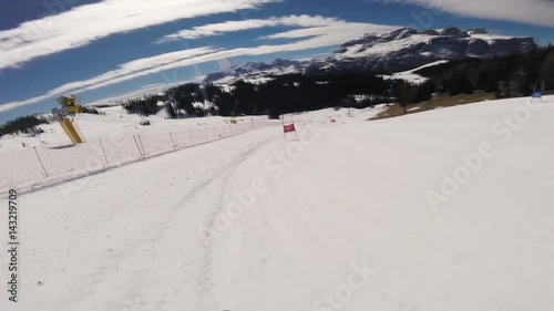 A skier doing slalom in the Alpine mountains