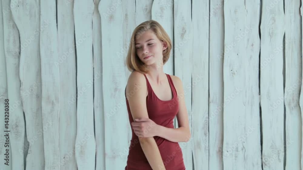Portrait of pretty and sensual teen girl without makeup. White wooden background. Natural beauty concept
