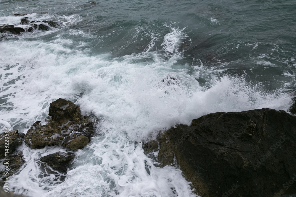 rocks and sea shot on cloudy day rocks and sea shot on cloudy day